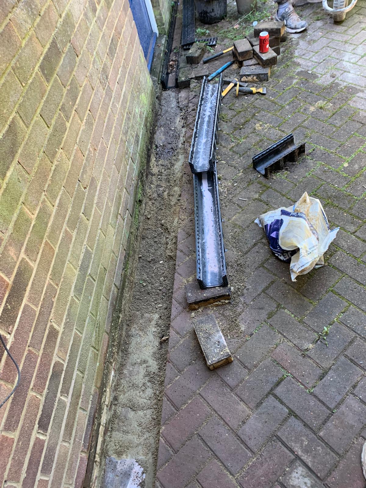 Drain installation in block paving for a local landscaping project