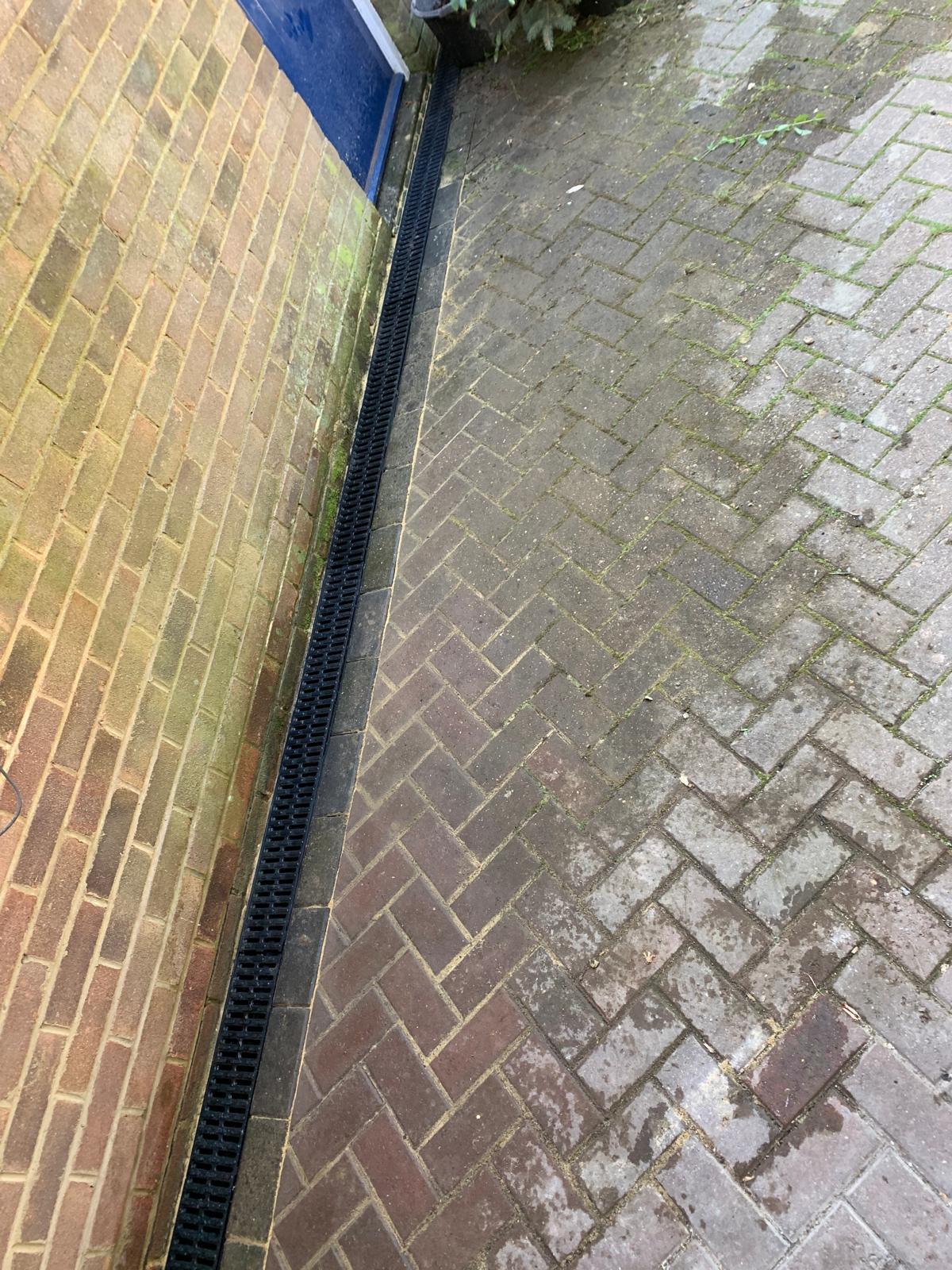 Drains installed in block paving