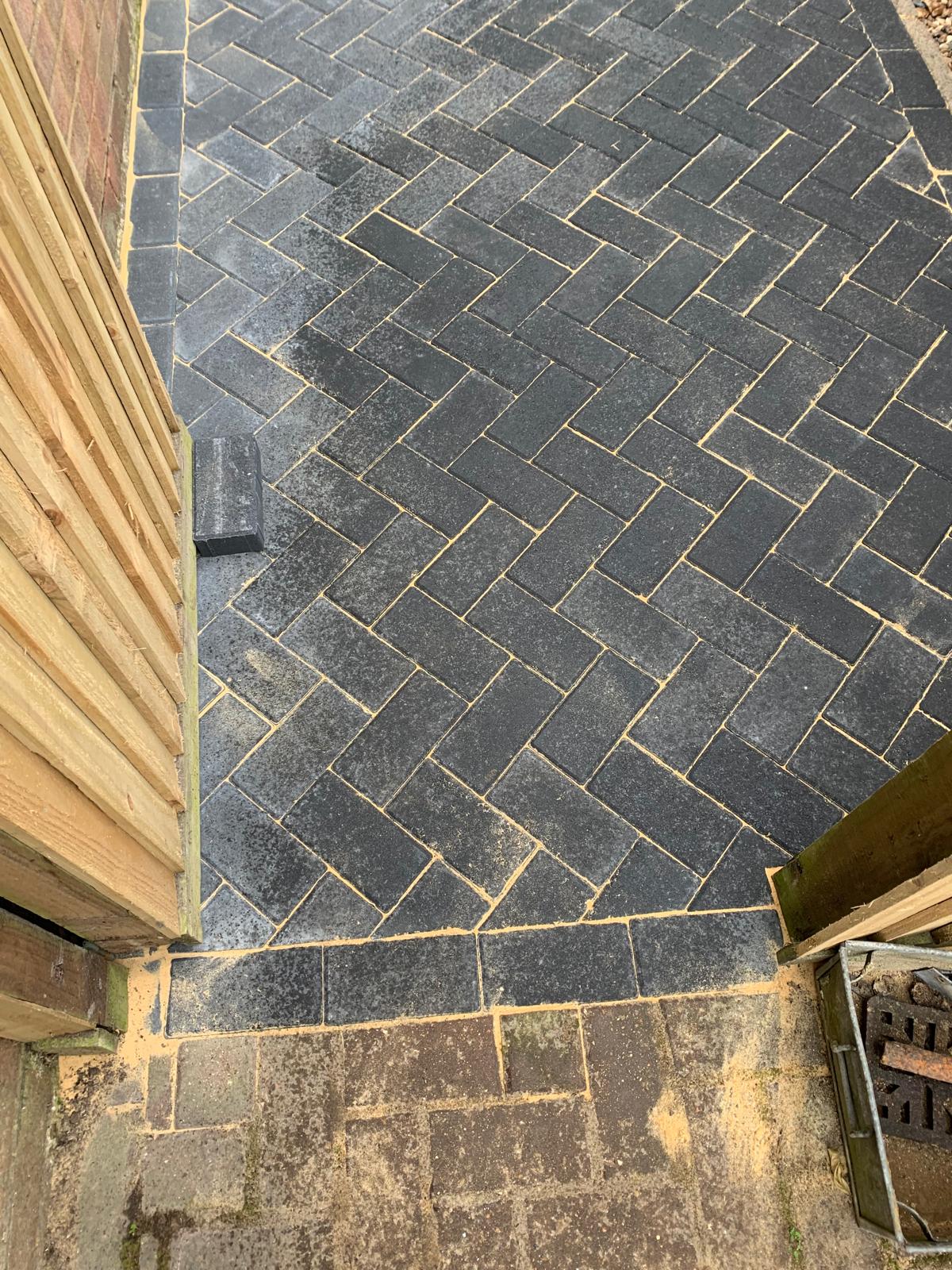 Edging on a block paved path for a local landscaping project