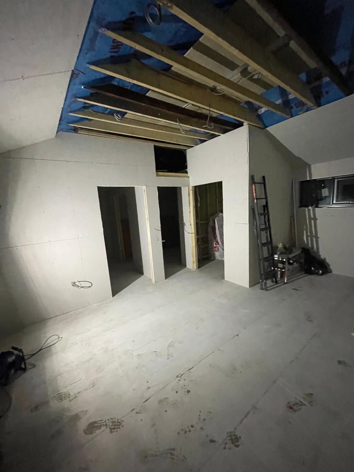 Electric installation being installed in the ceiling on a conversion job