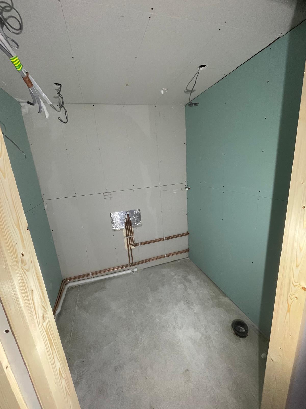 Electrics and pipe work being installed for a bathroom in a local conversion project