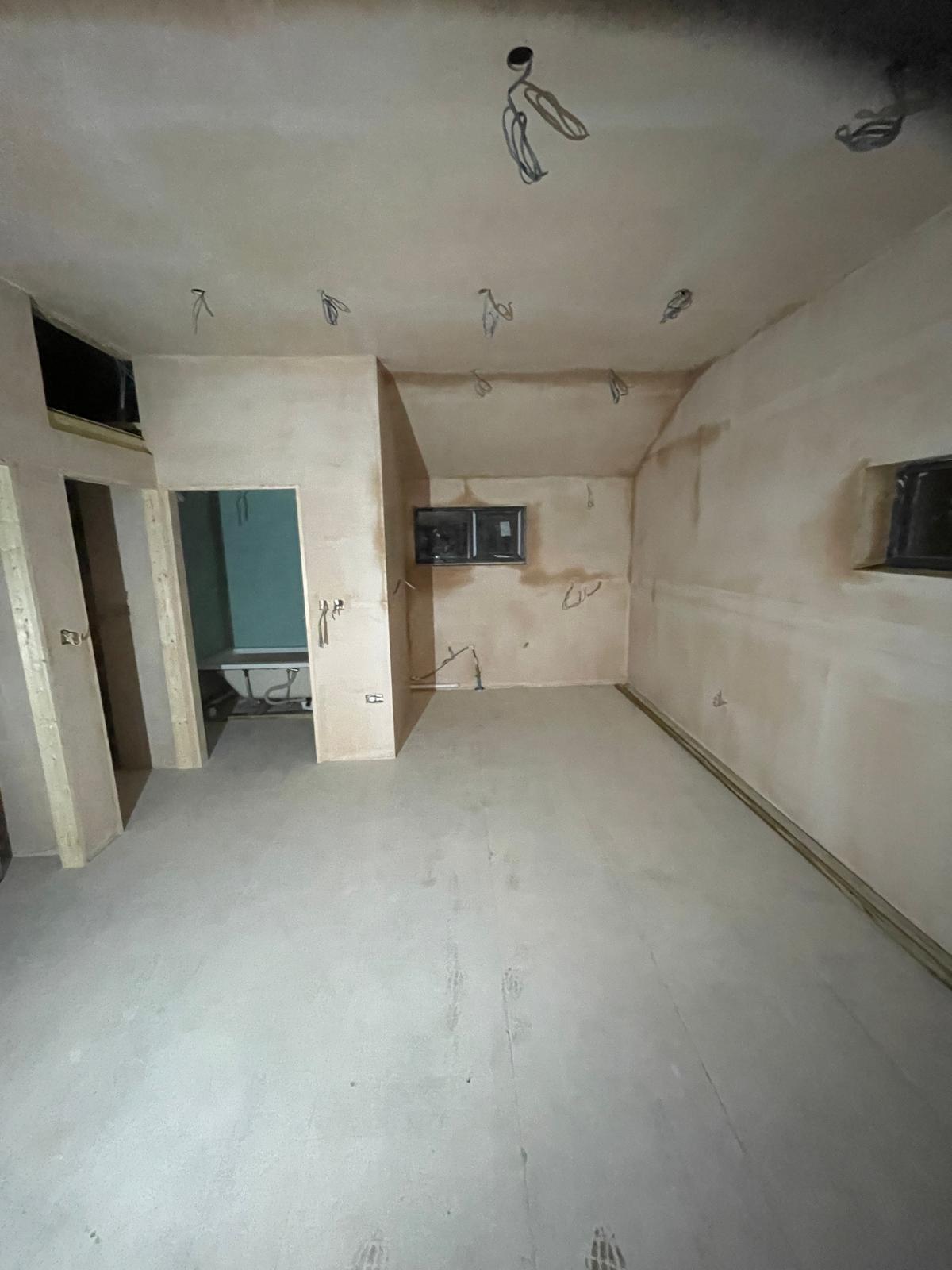 Electrics in place and wall prepared for painting for a conversion project in Kent