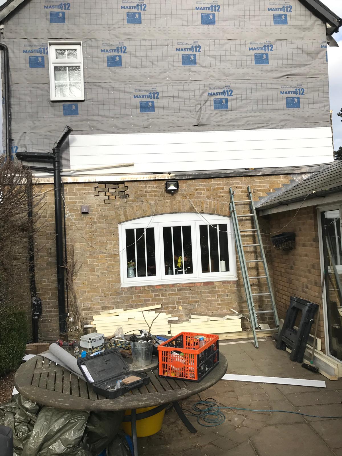 Exterior cladding starting to be installed on the side of the house for a local project in Kent