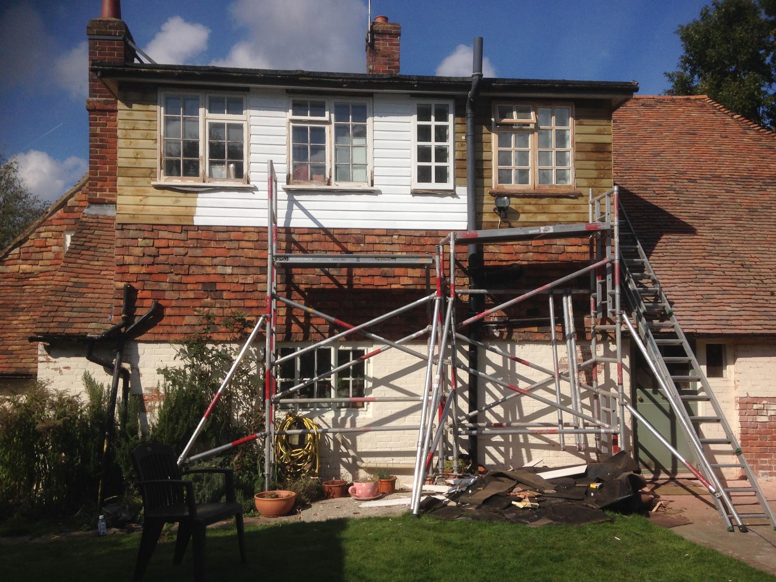Exterior white cladding being installed