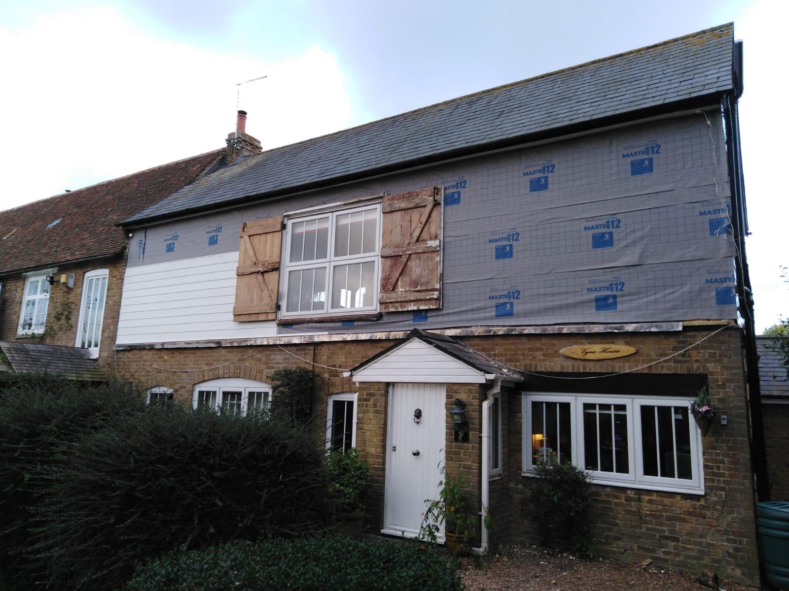 Exterior white cladding installation for a local project in Kent