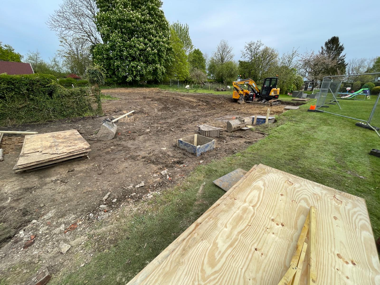 Extra digger work in preparation for swimming pool installation