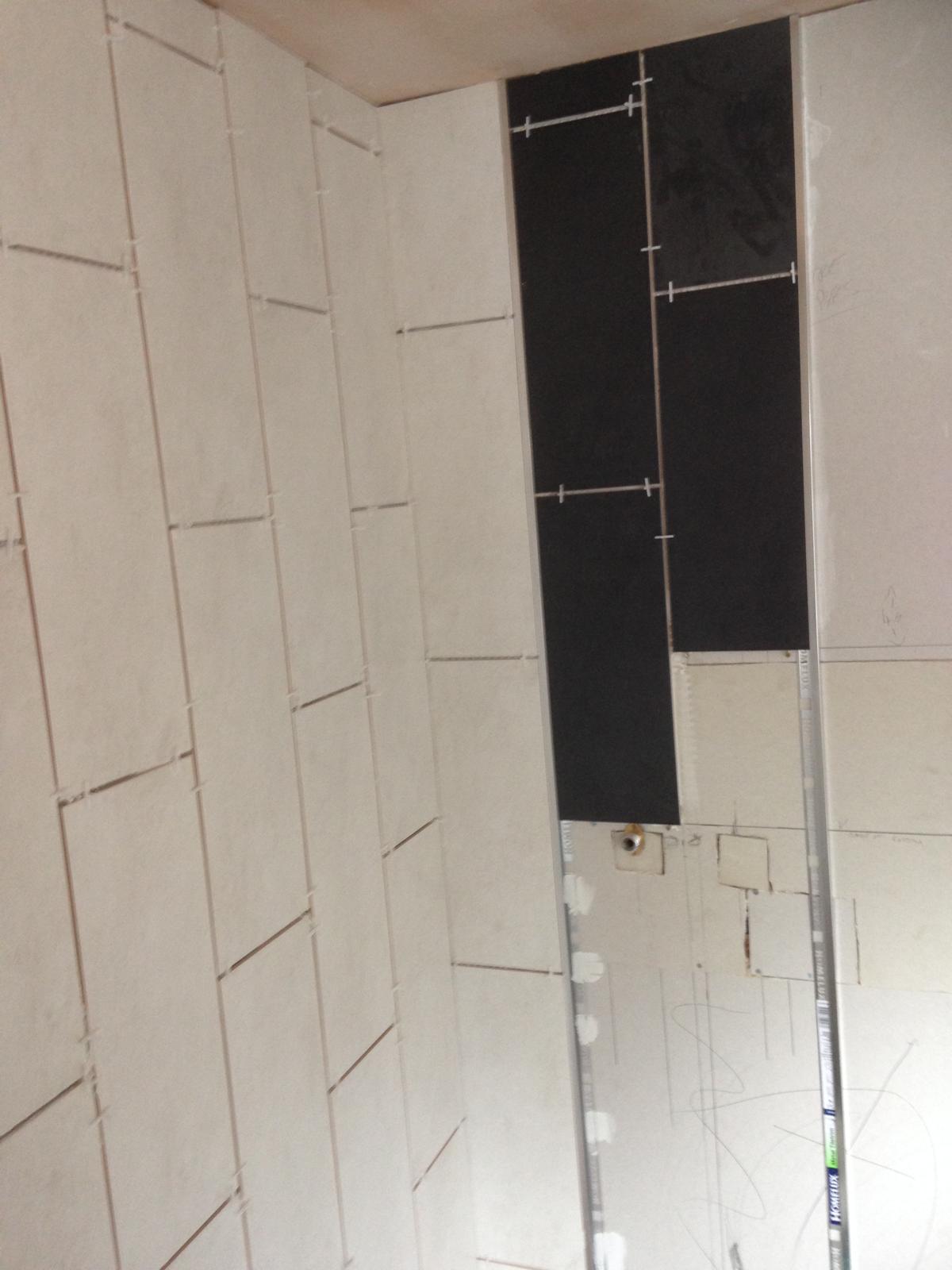 Feature wall tile installation for a local bathroom project 