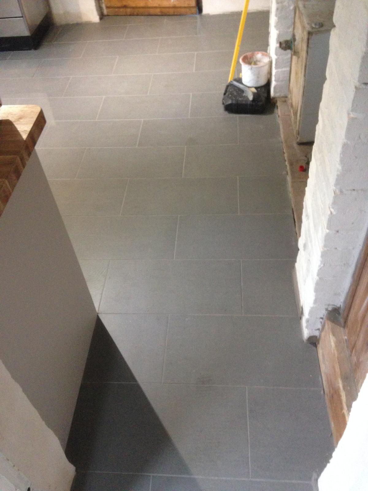 Floor tile installation in a kitchen for a decorating project