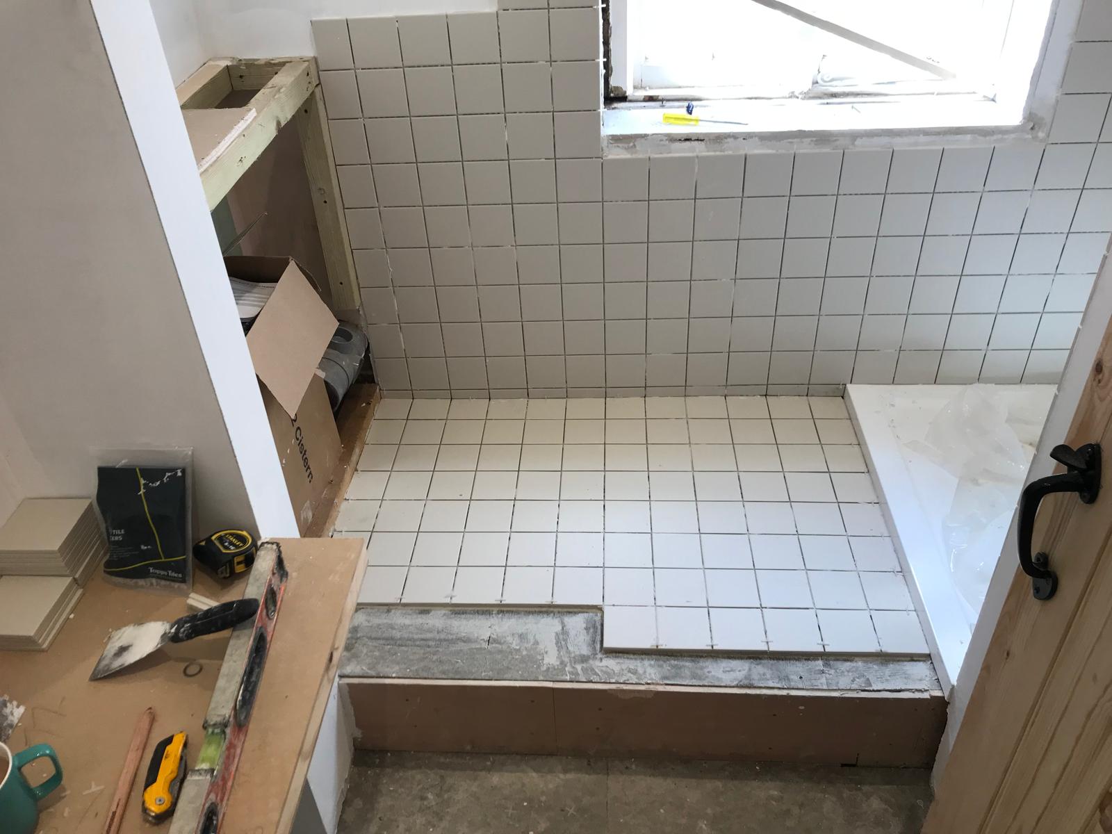 Floor tile installation on a bathroom project