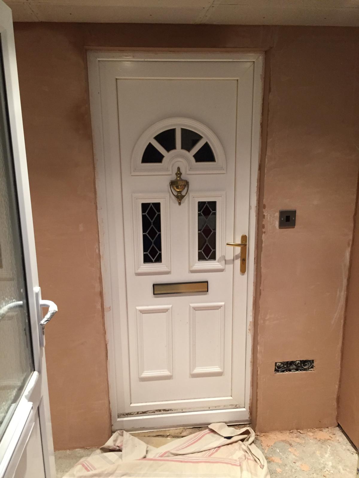Front door installation on a porch extension project in Kent