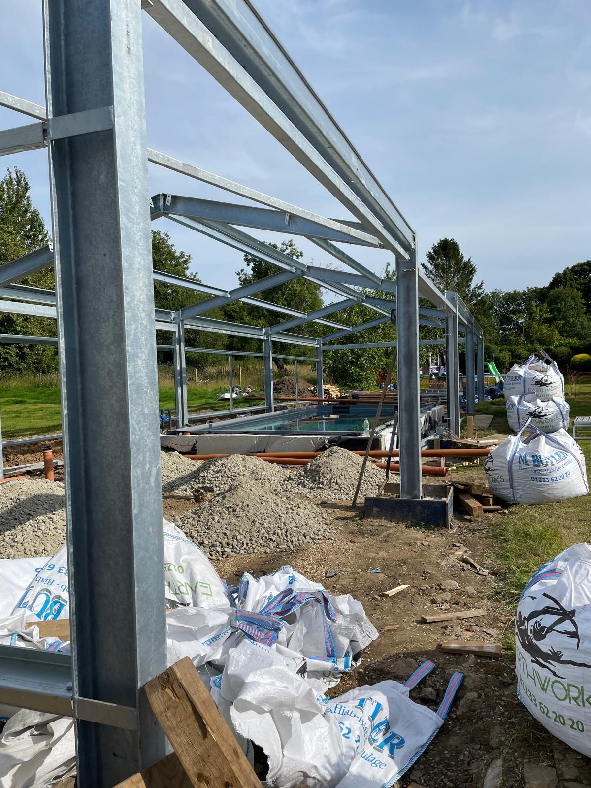 Full view of metal framework and swimming pool