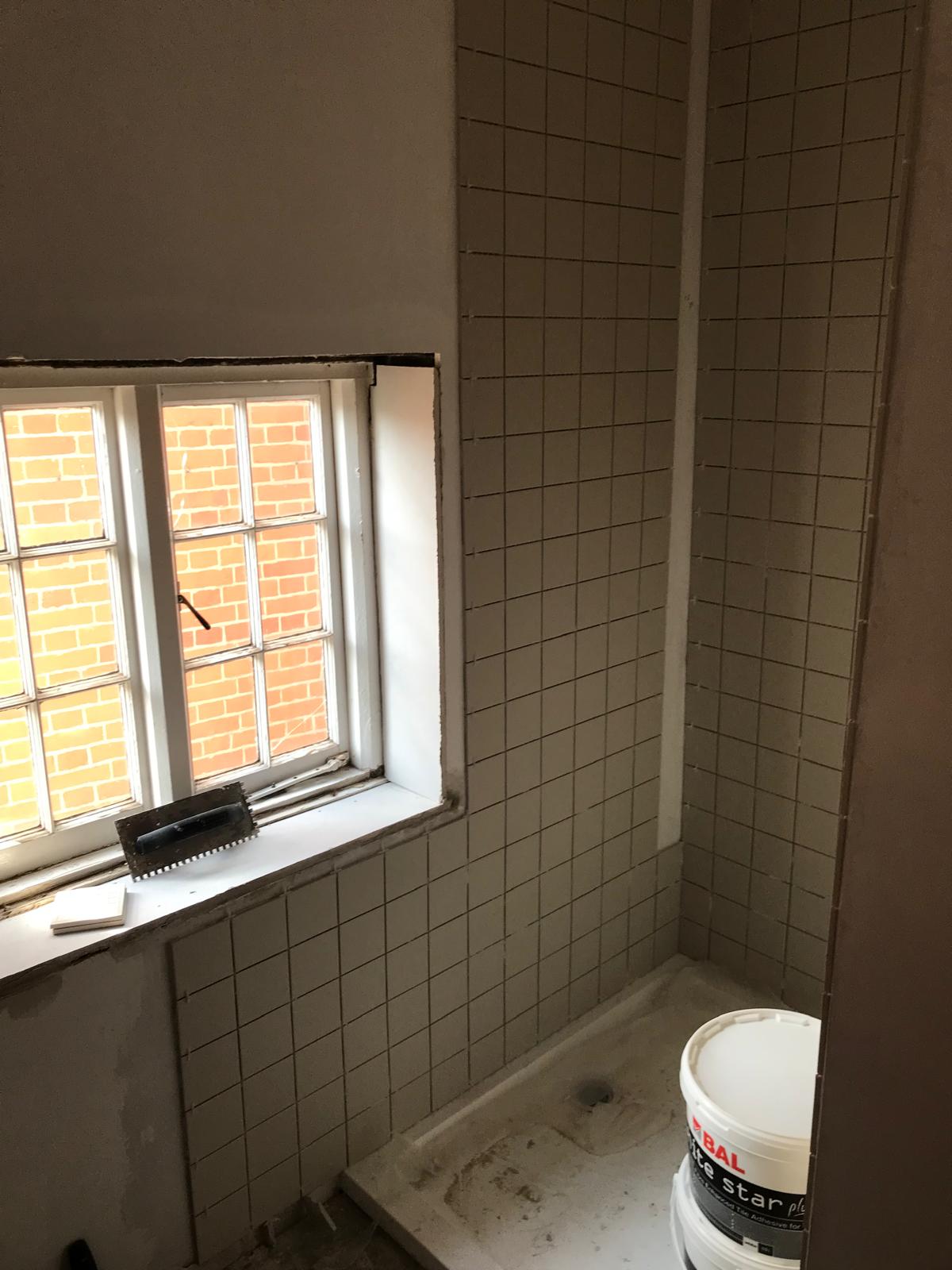 Full wall tile installation for a bathroom project