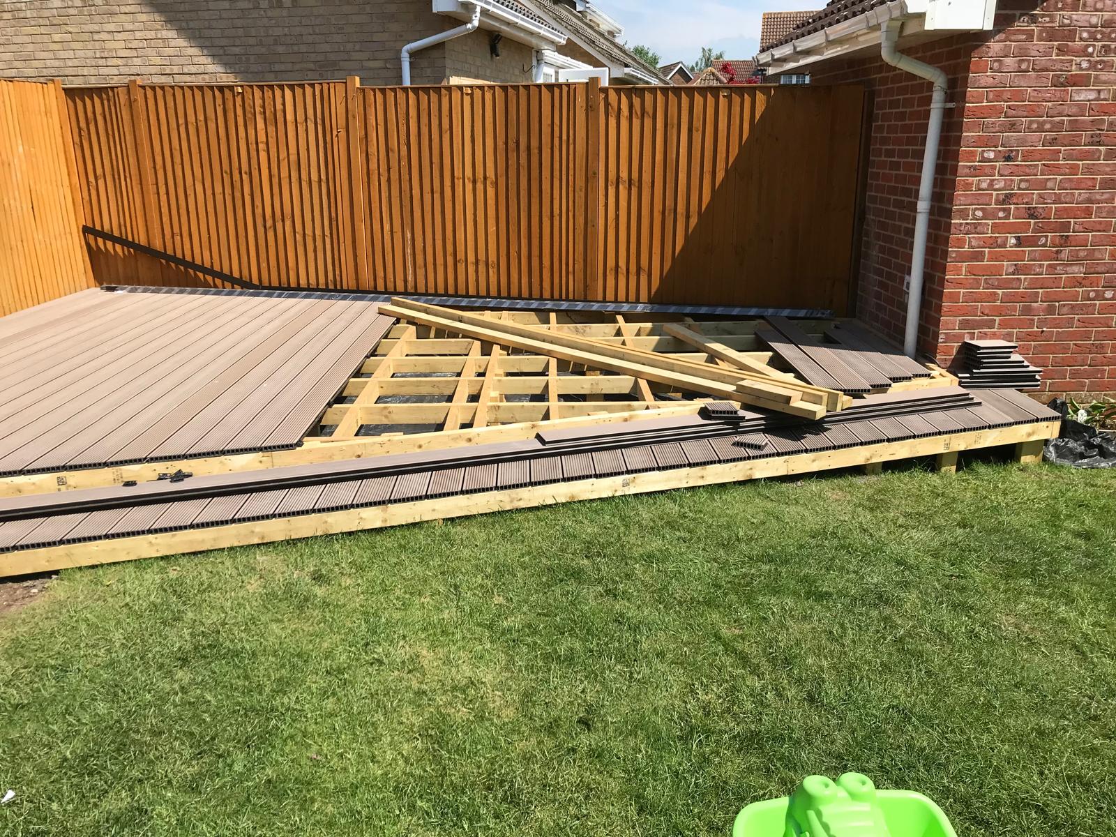 Grey decking installation for a landscaping project