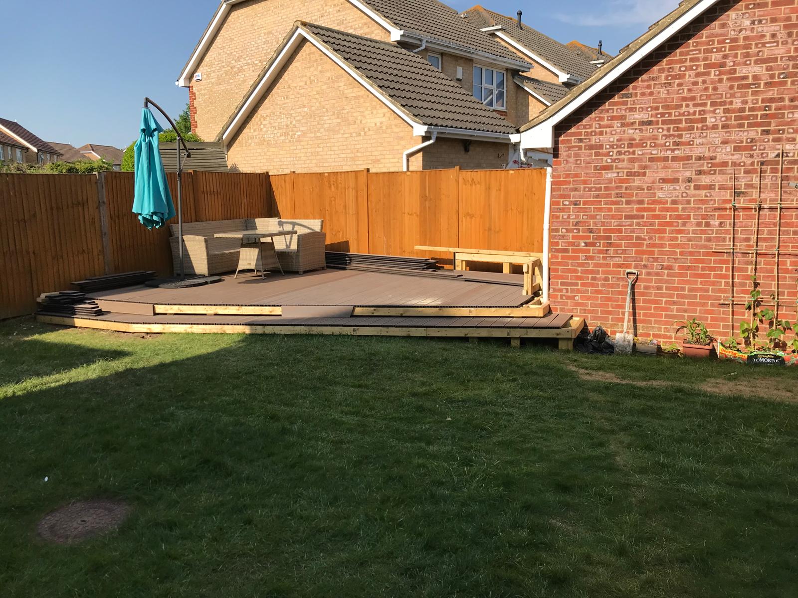 Grey decking installation for a local landscaping project