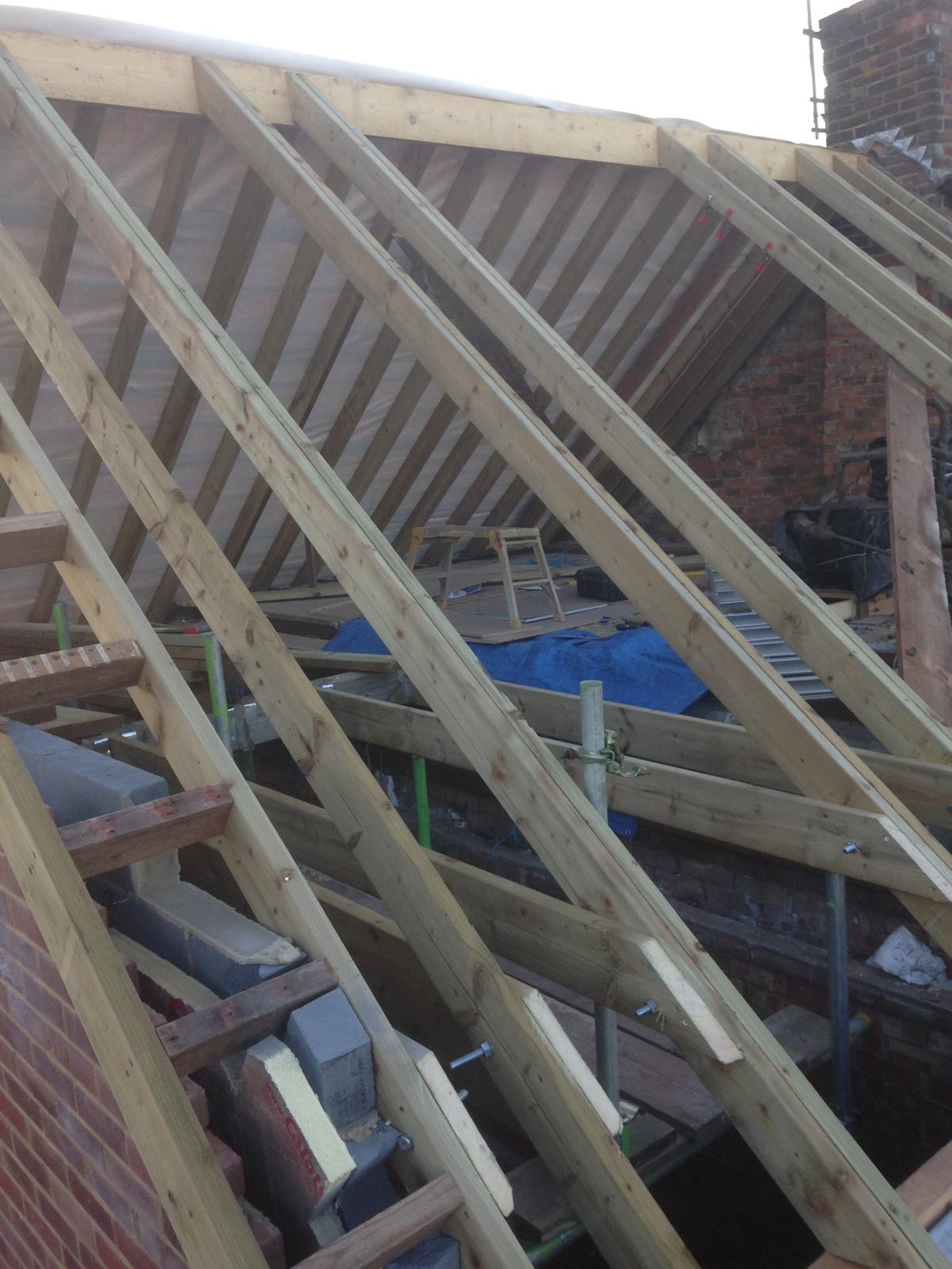Installation of a roof in progress