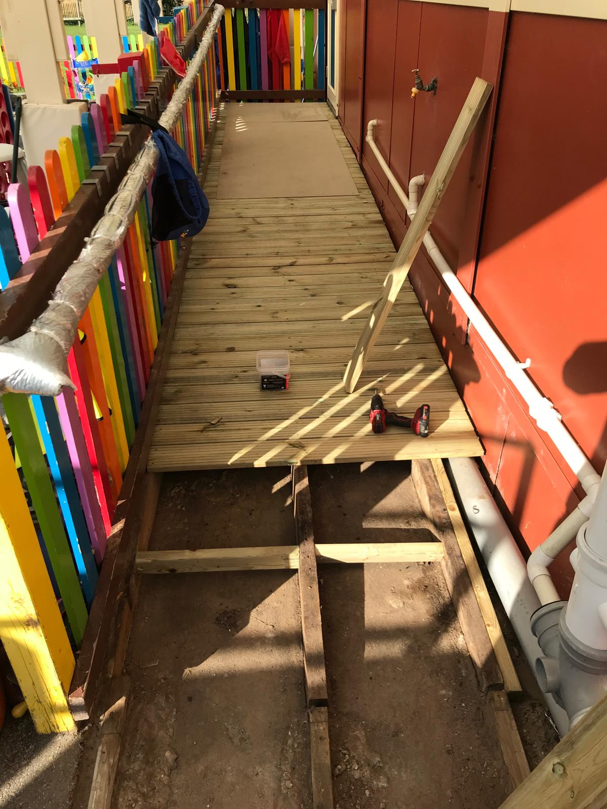 Installation of deck boards on a slope in a nursery
