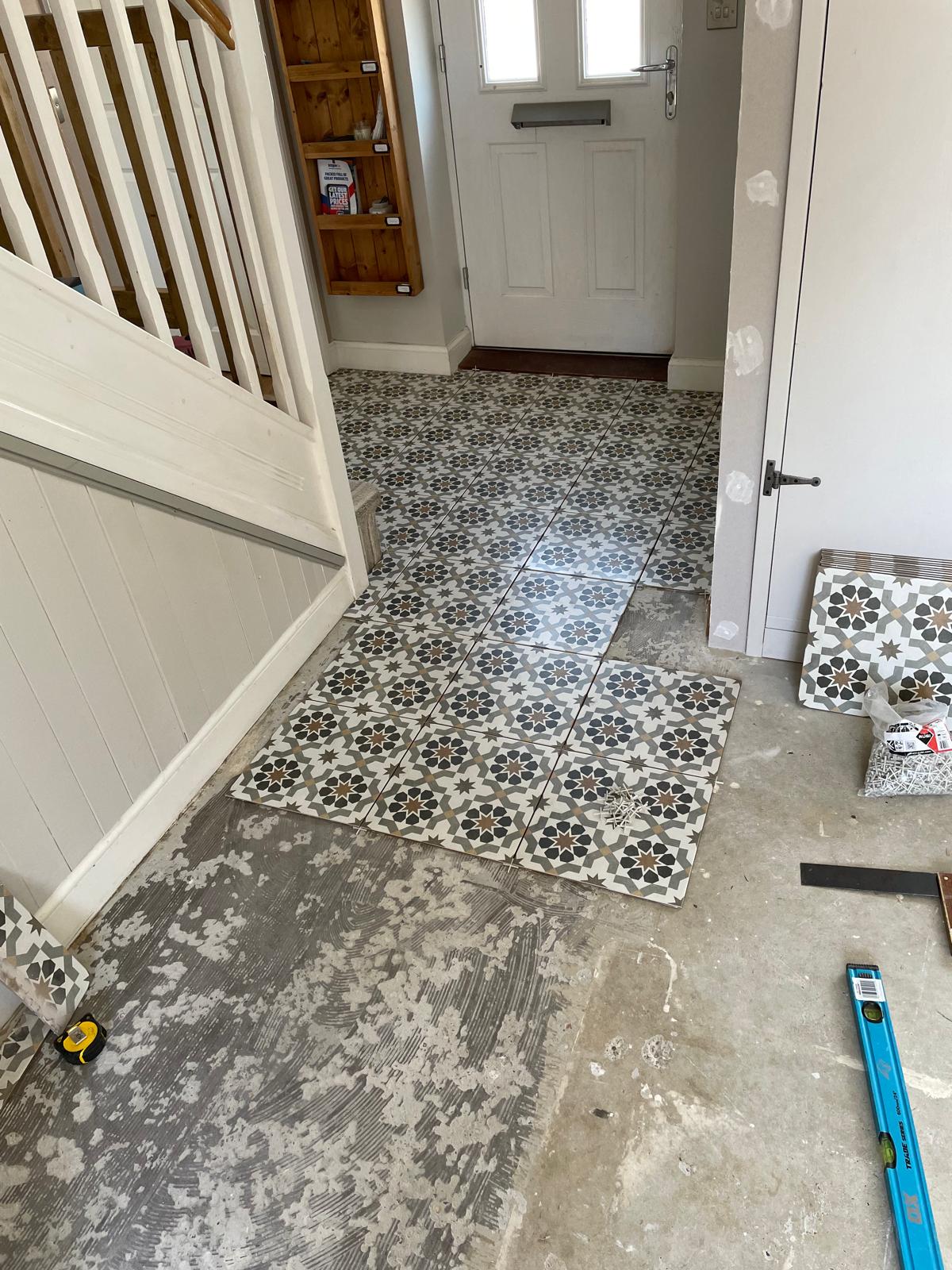Installation of pattern floor tiles for a local decorating job in Kent