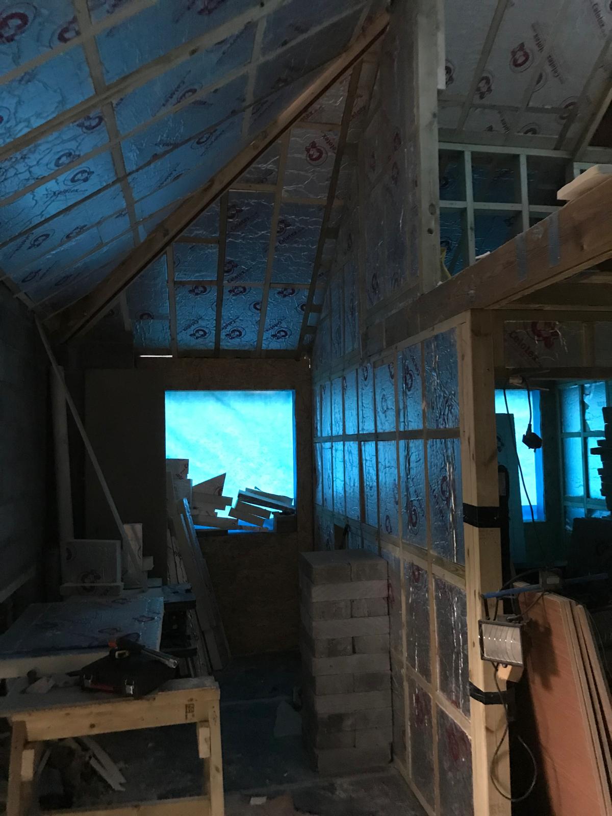 Insulation installation on the stone wall extension project in Kent