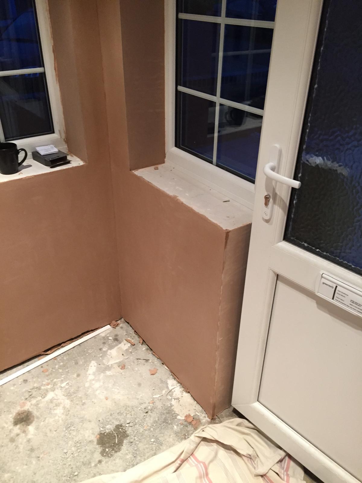 Interior walls plastered on a porch extension project in Kent