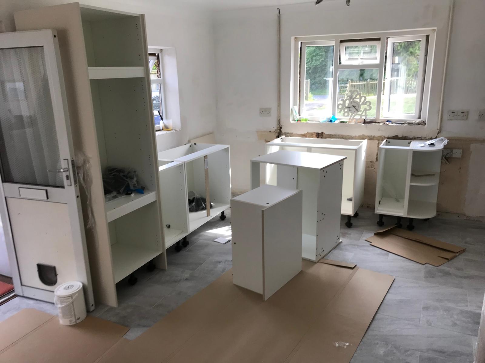 Kitchen carcasses being installed on a kitchen installation project