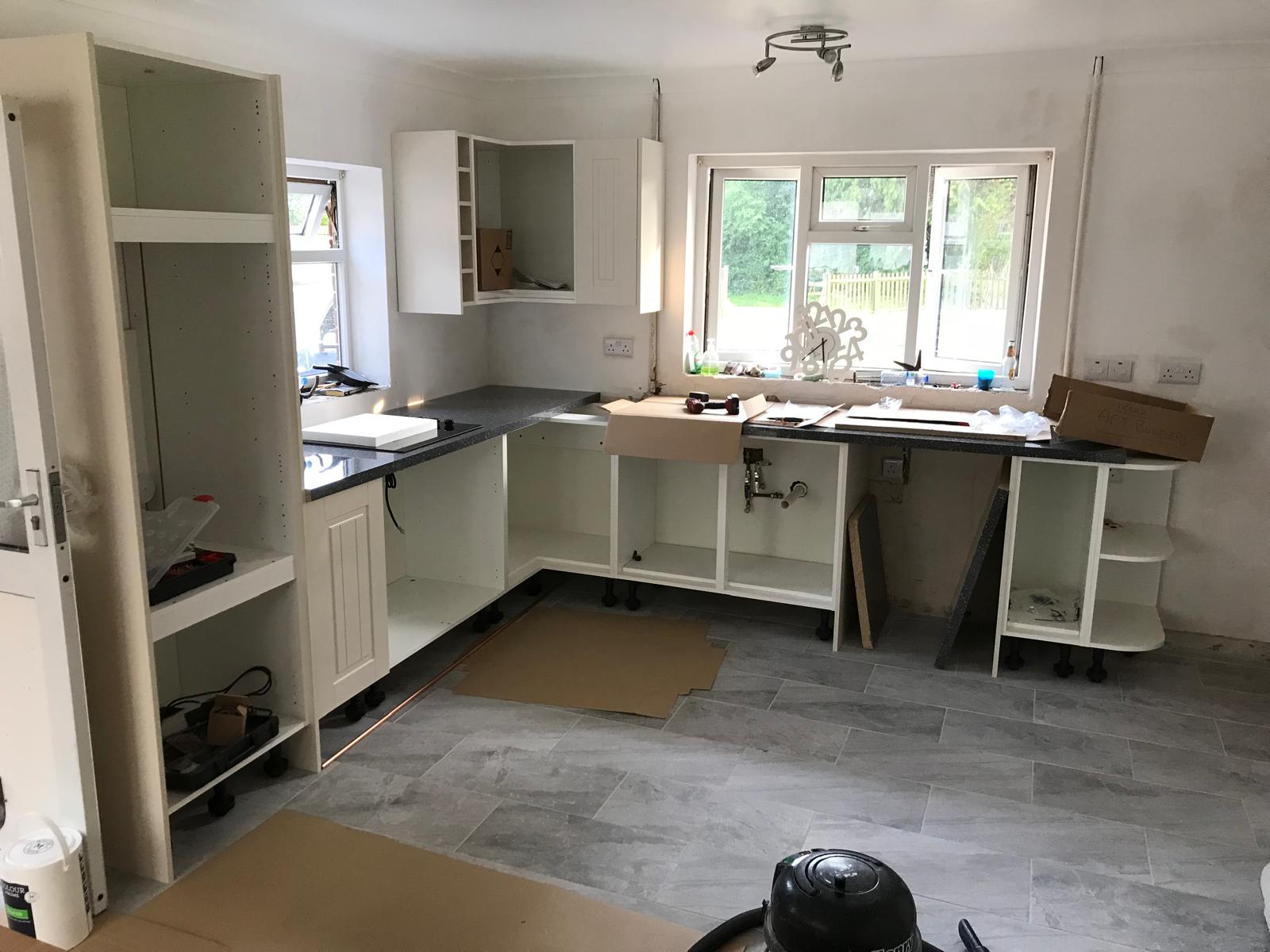 Kitchen cupboards being installed on a kitchen installation project