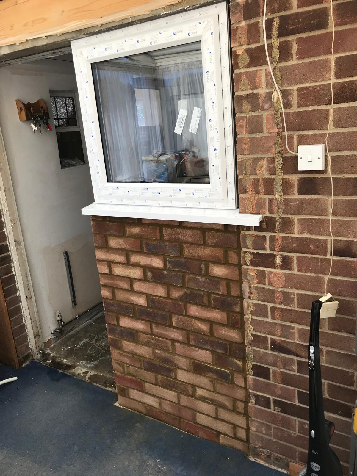 Kitchen installation project wall extension with window installation