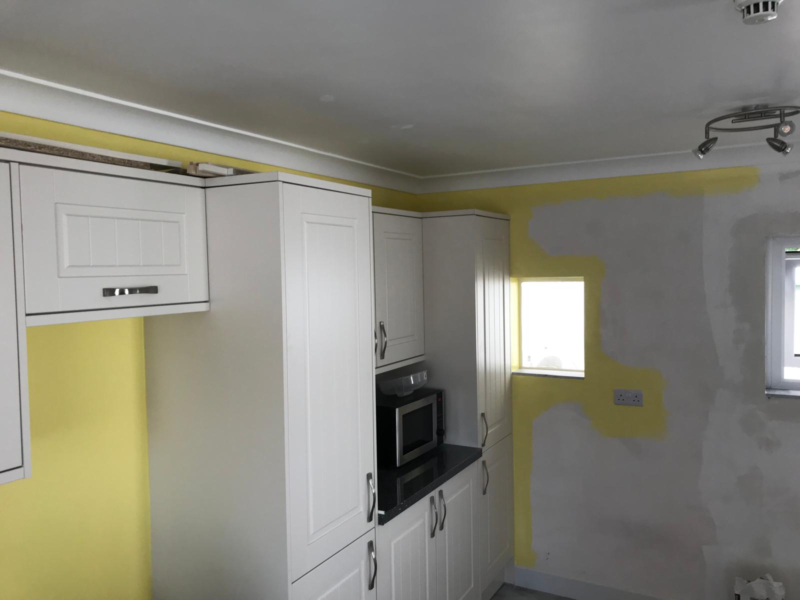 Kitchen installation project yellow painted walls