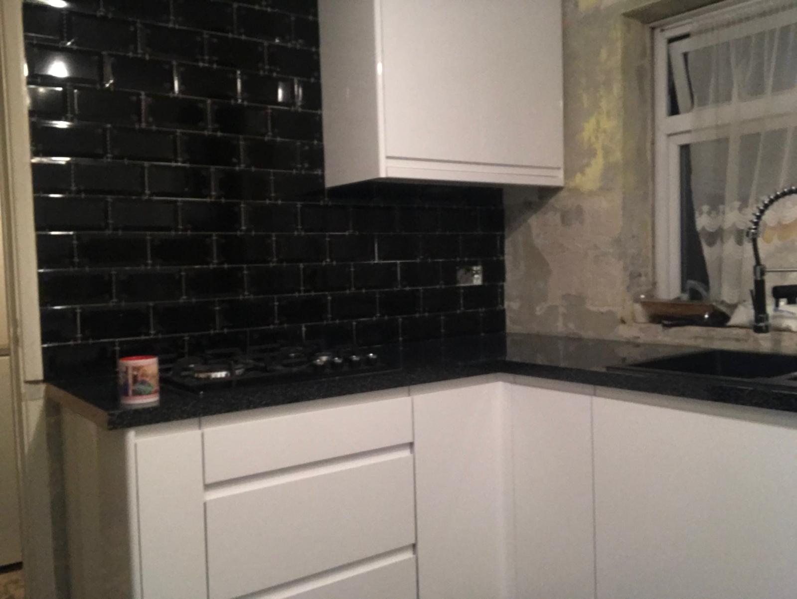 Kitchen project black wall tile installation
