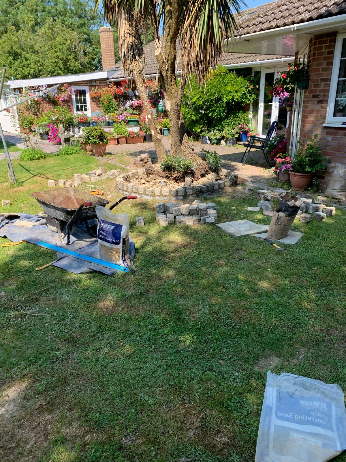 Landscaping project decorative stone wall installation
