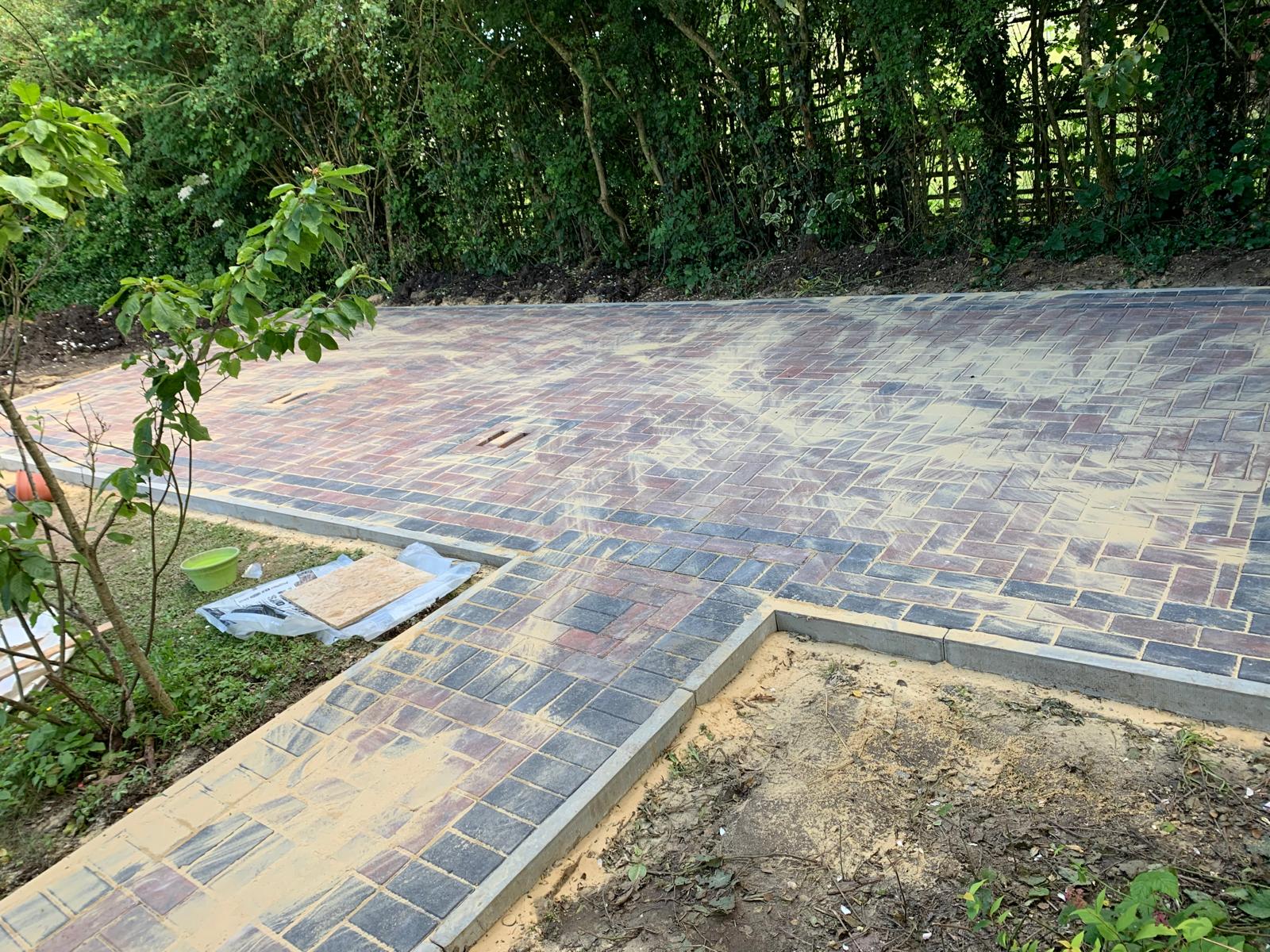 Landscaping project with block paving area and pathway 