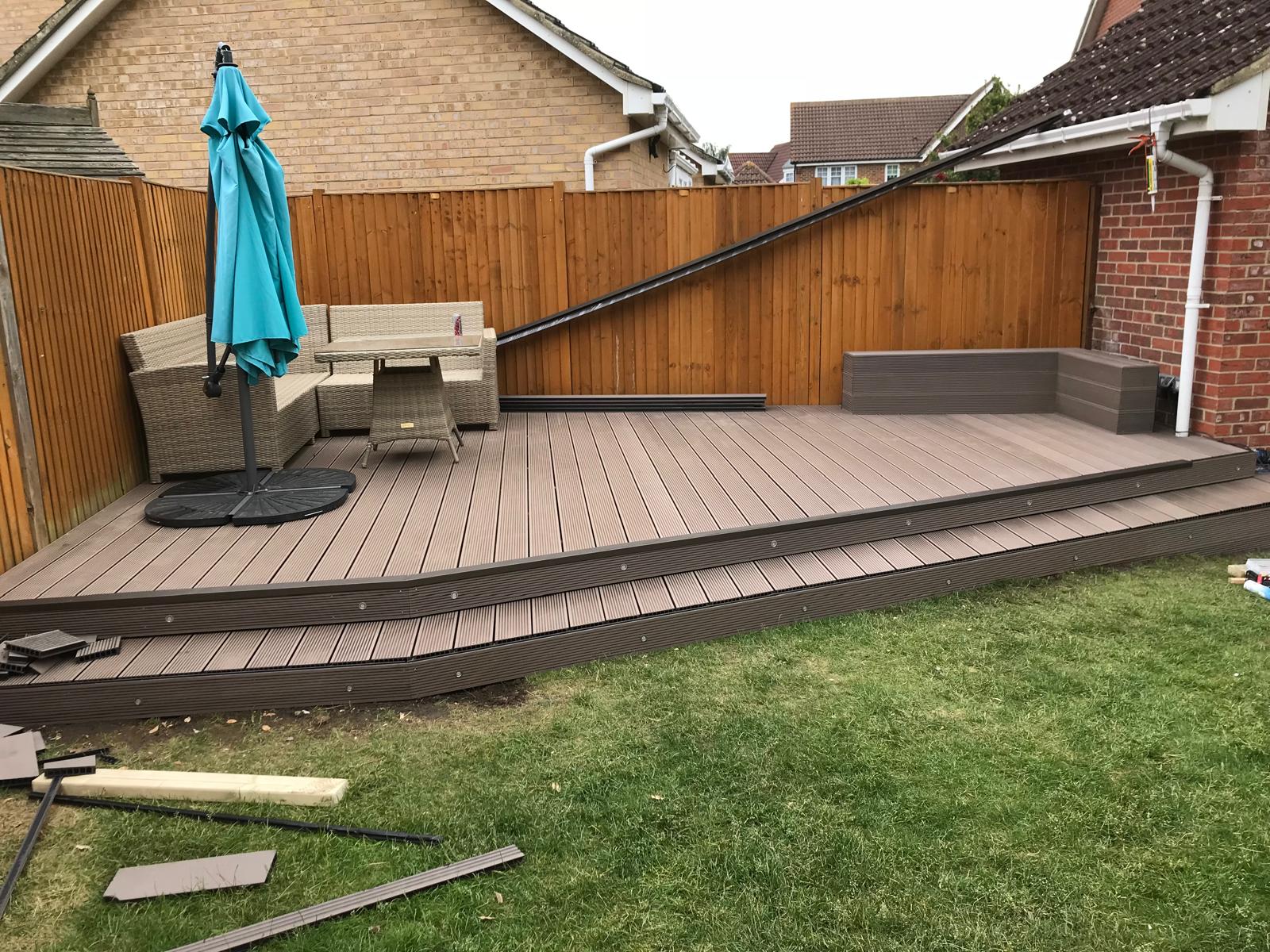 Landscaping project with grey decking installation