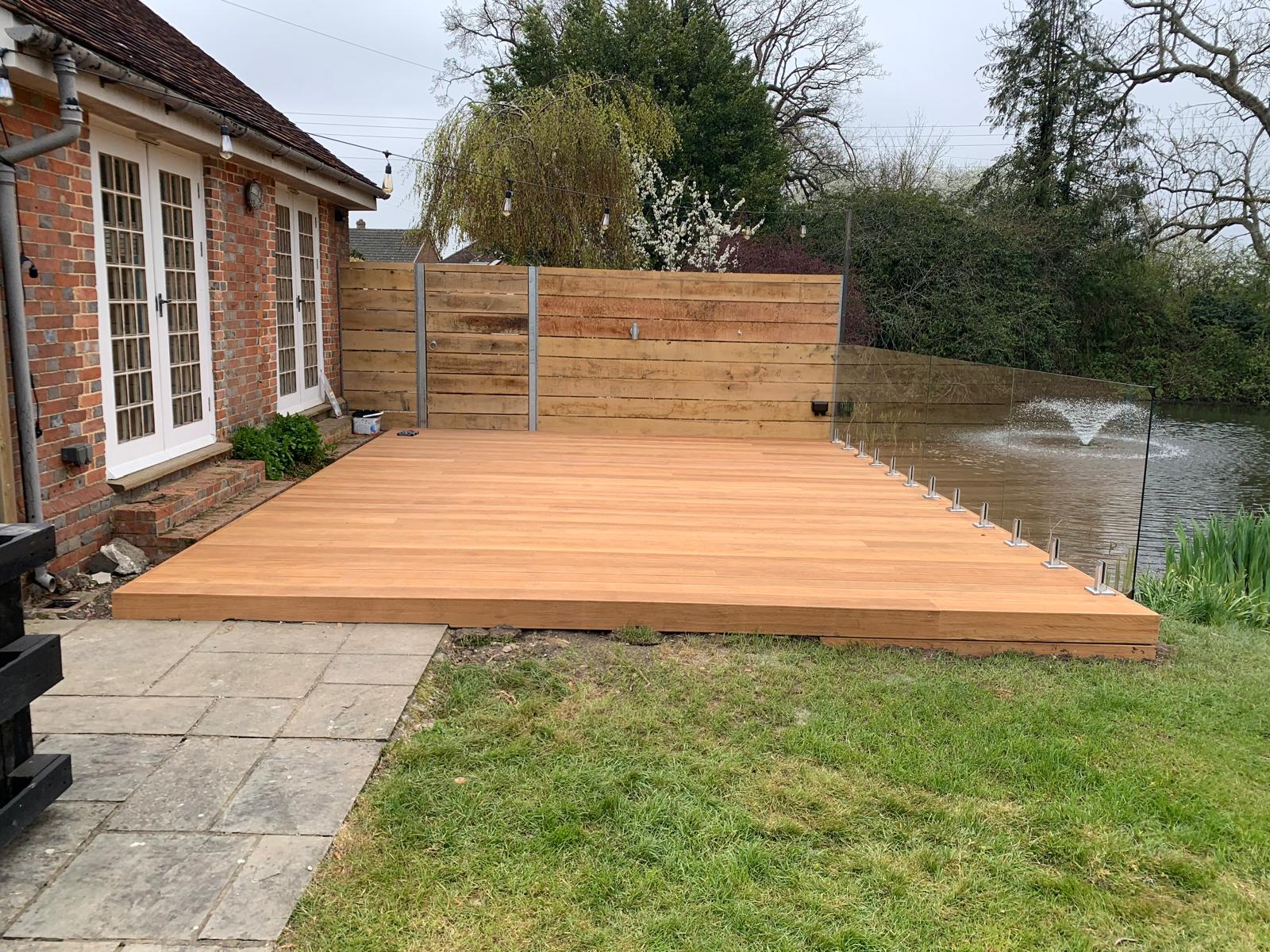 Light brown decking installation for a landscaping project in Kent