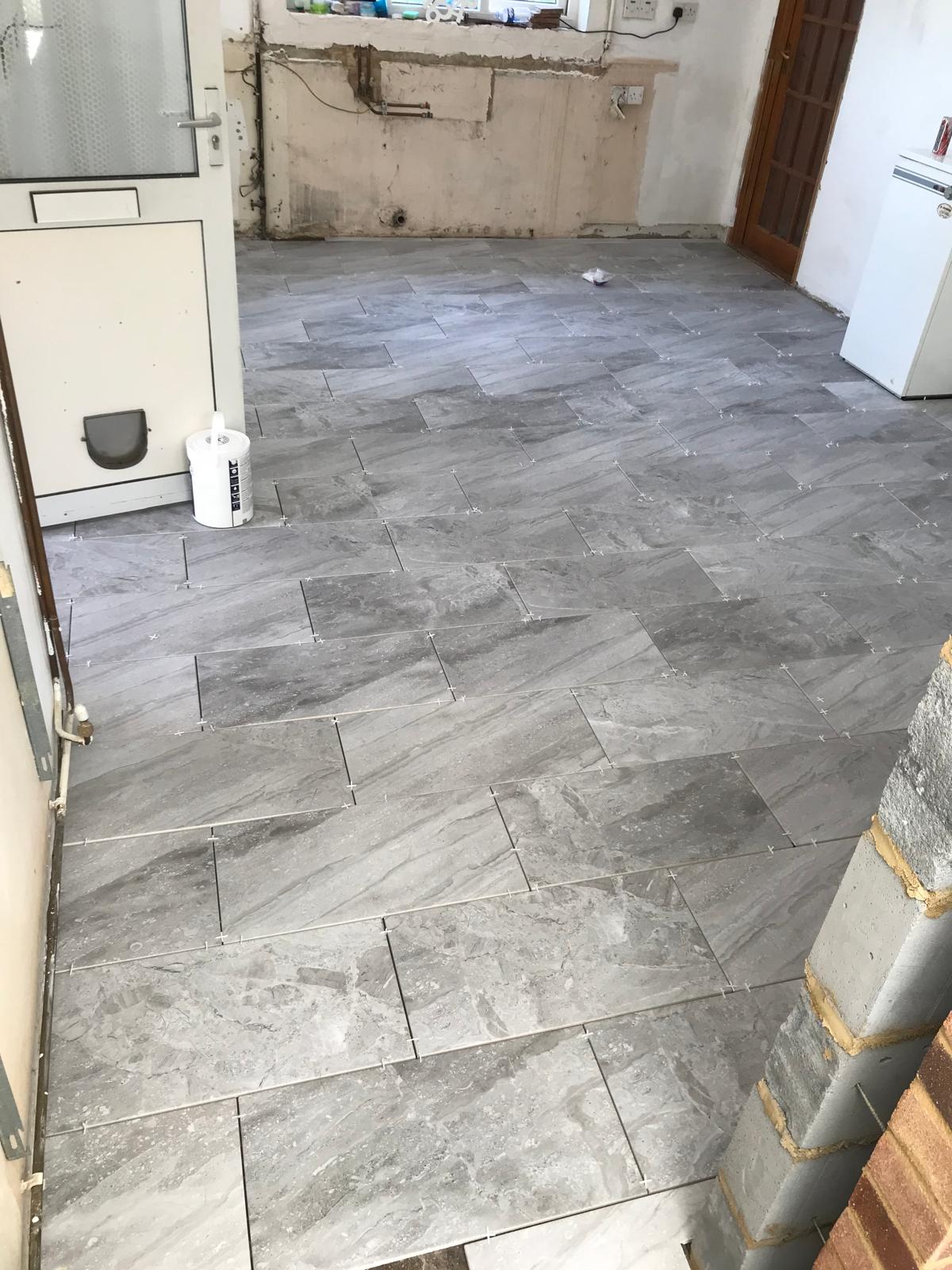 Light grey floor tile installation for local kitchen project
