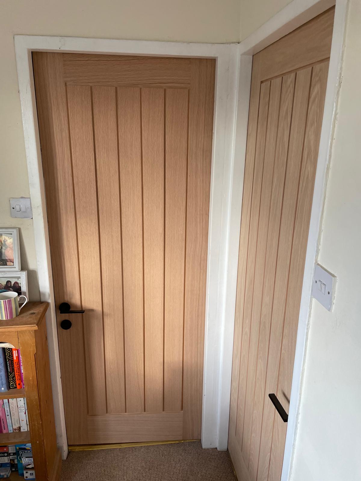 Light wood straight panel door installation for a local decorating project in Kent