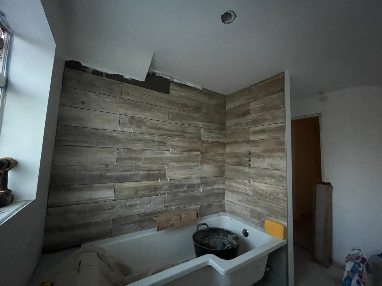 Local bathroom project wooden effect wall tile installation