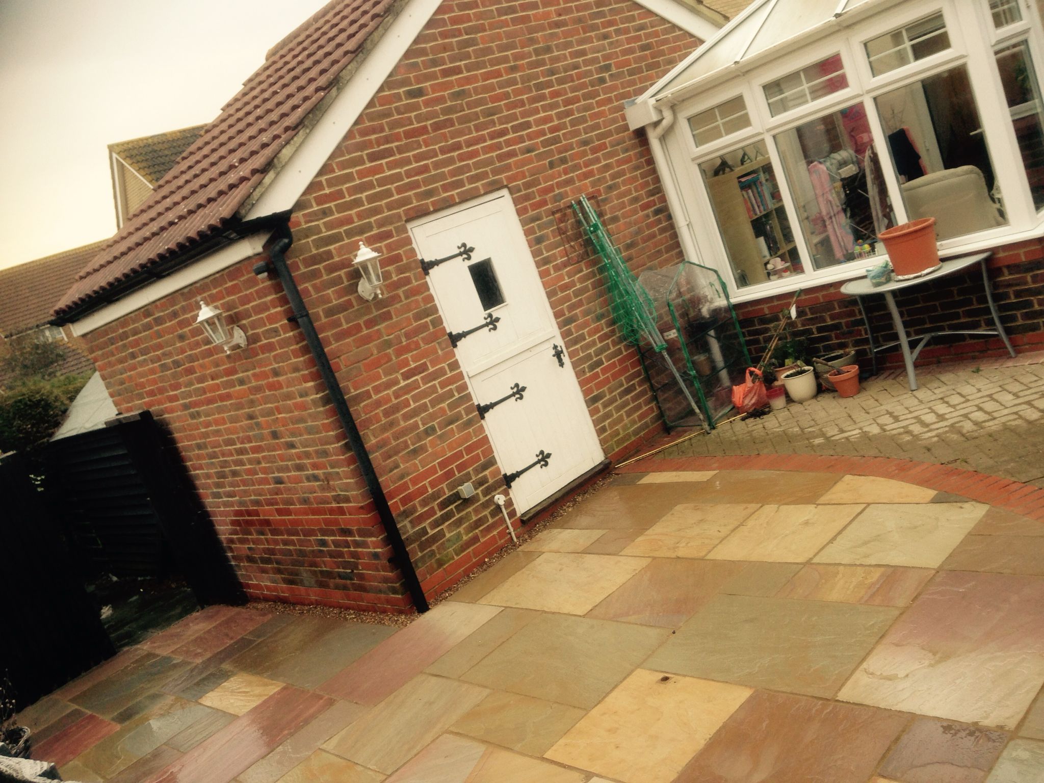 Local landscaping project with multi coloured patio installation