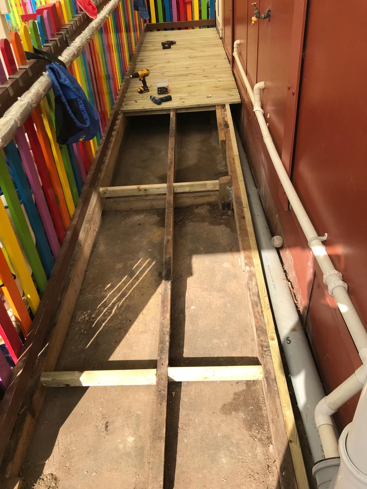 Local nursery deck board installation on a walk way slope