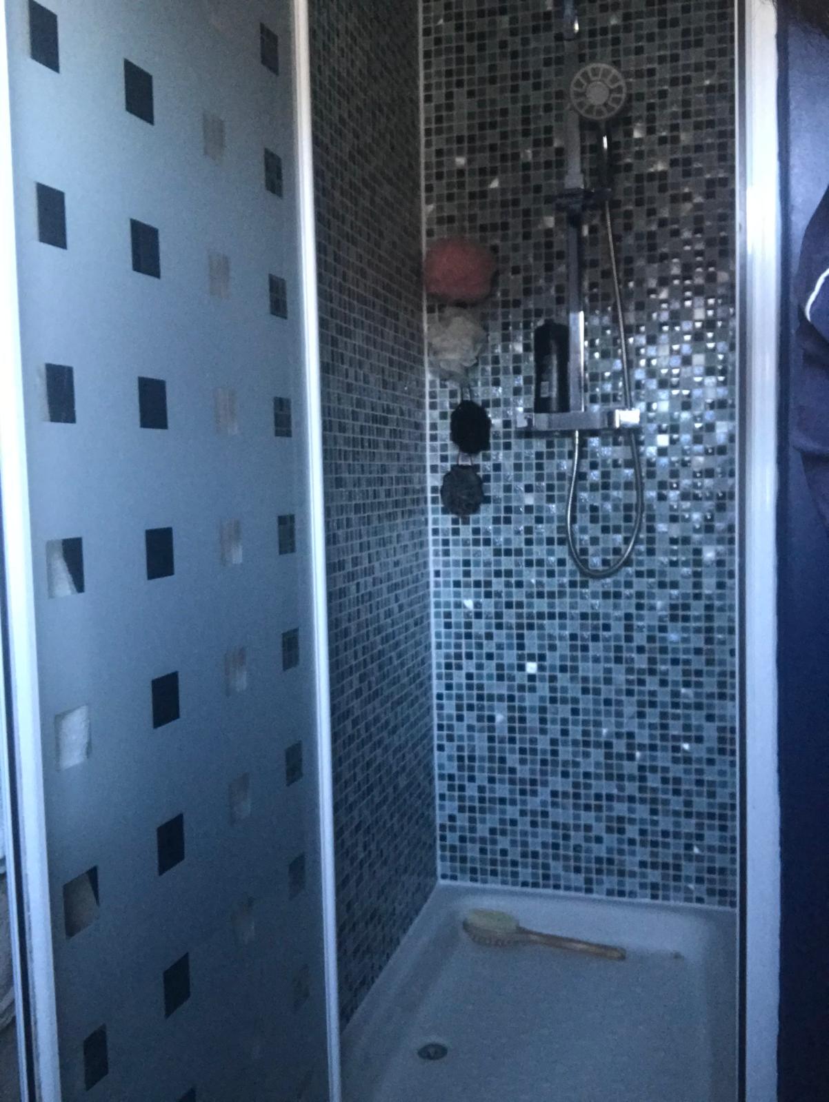 Mosaic shower wall tile installation for a bathroom project in Kent