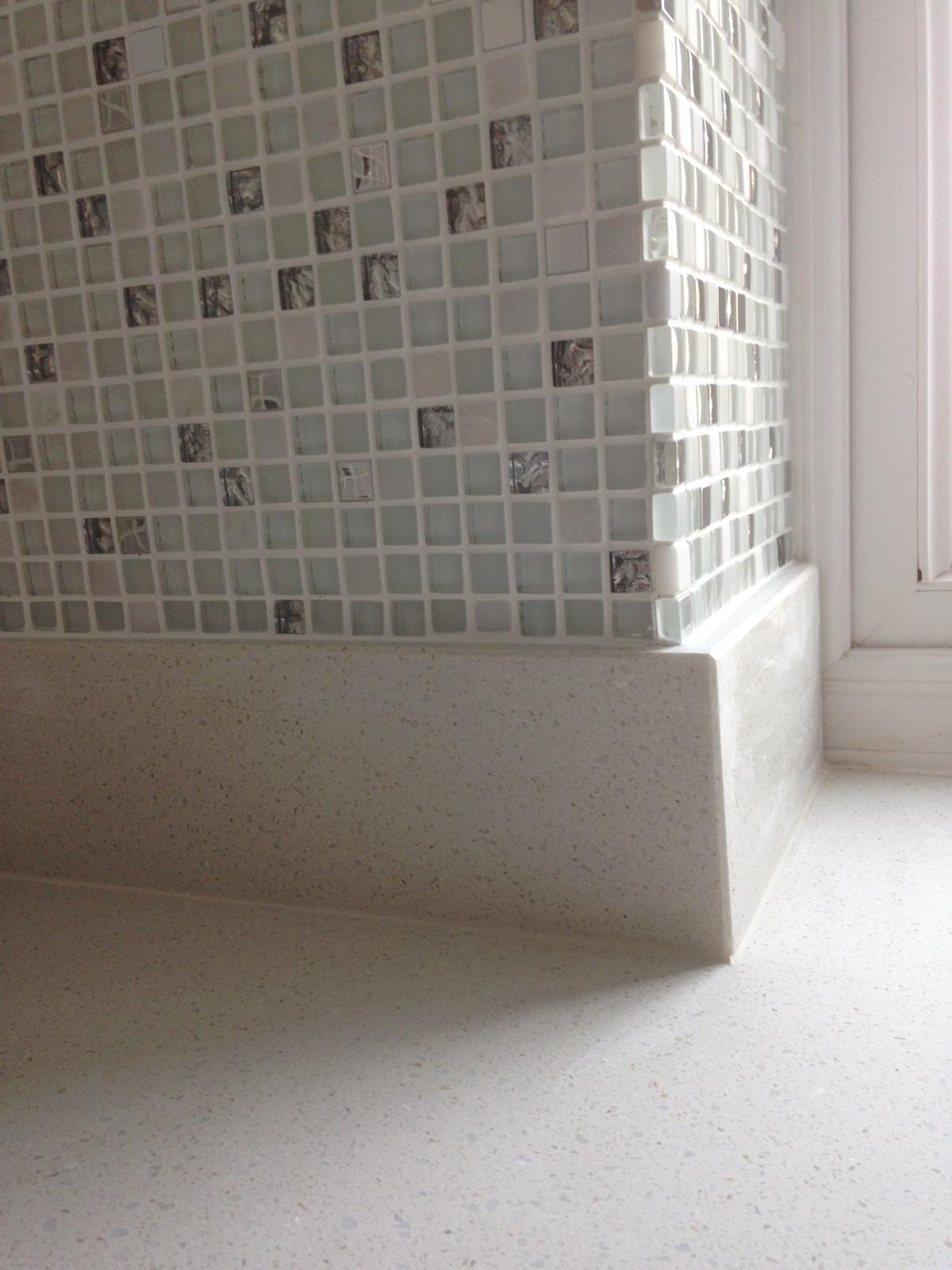 Mosaic wall tiles installed on kitchen wall