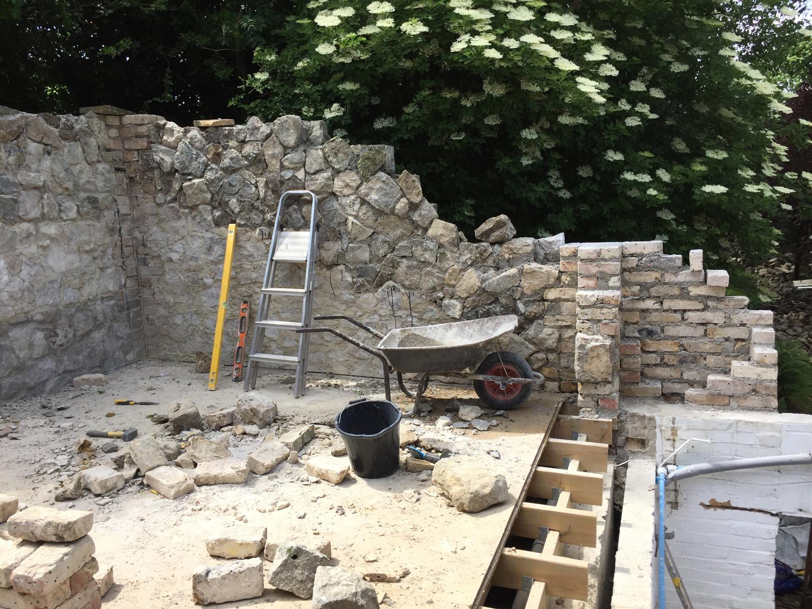 Natural stone wall beginning stages of installation