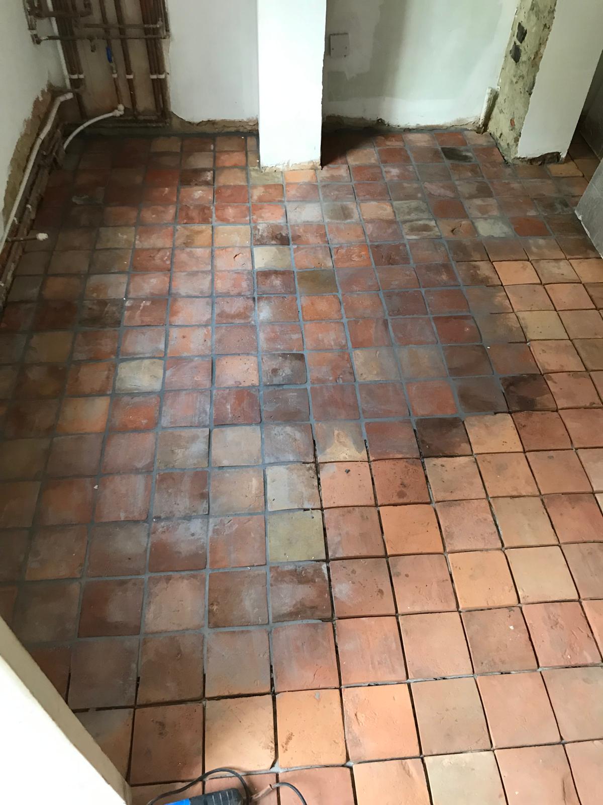 Natural terracotta floor tile installation