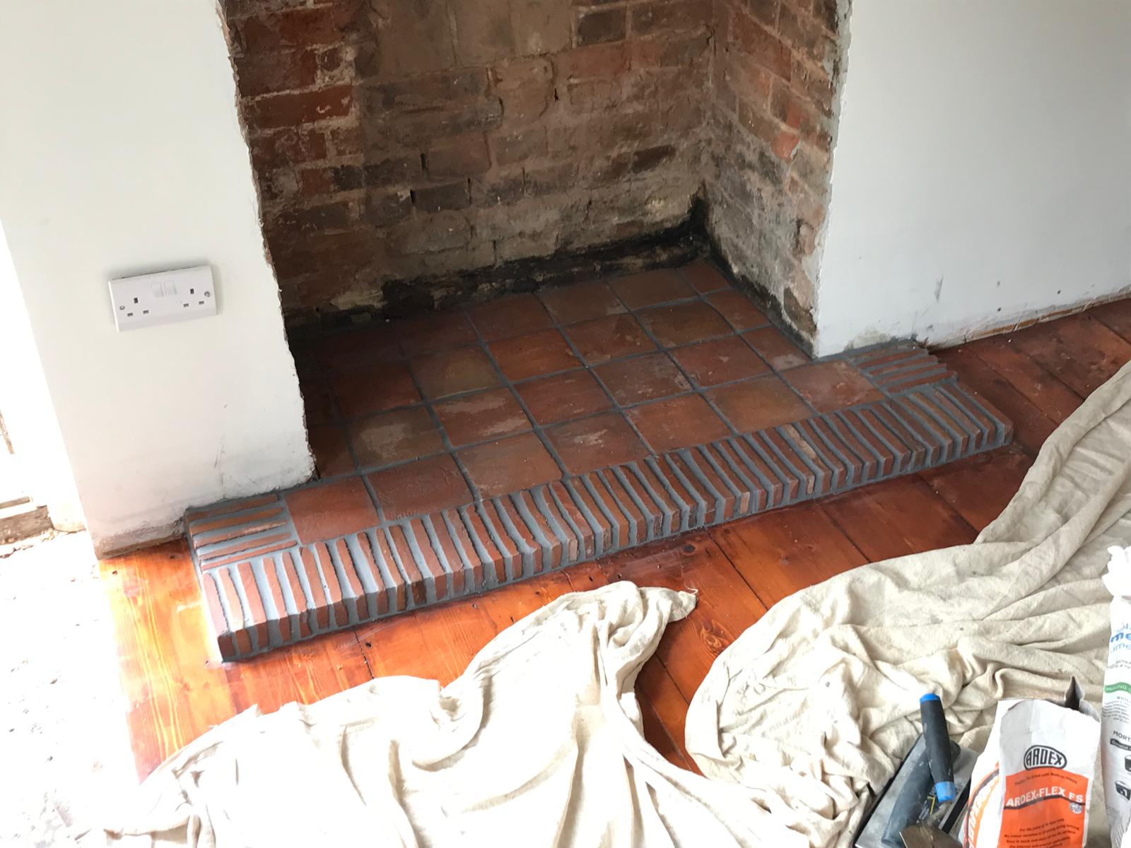 Natural terracotta tiles installed in fire place for a local project in Kent