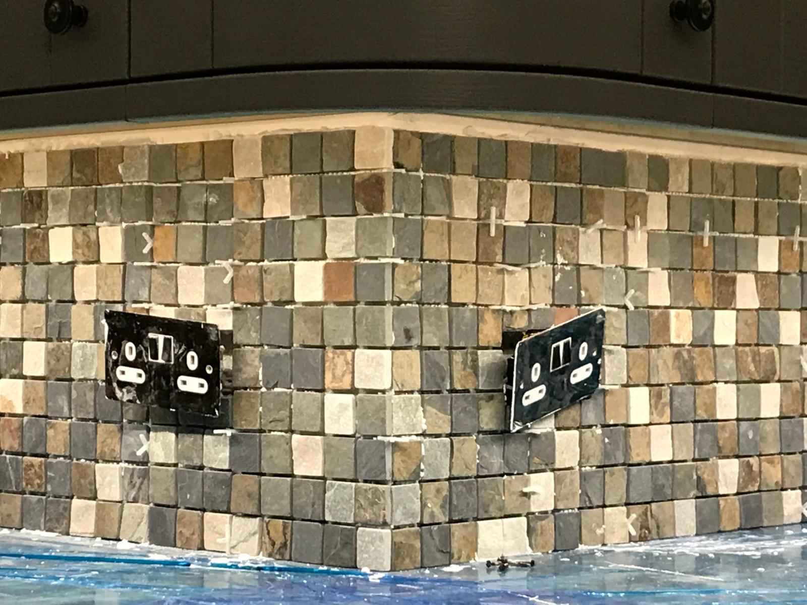 Natural mosaic wall tile installation