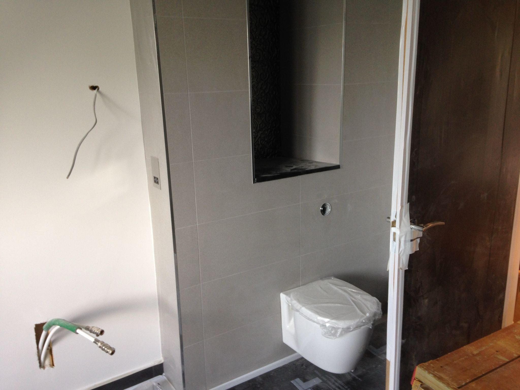 Of the wall toilet installation for a local bathrrom project in Kent