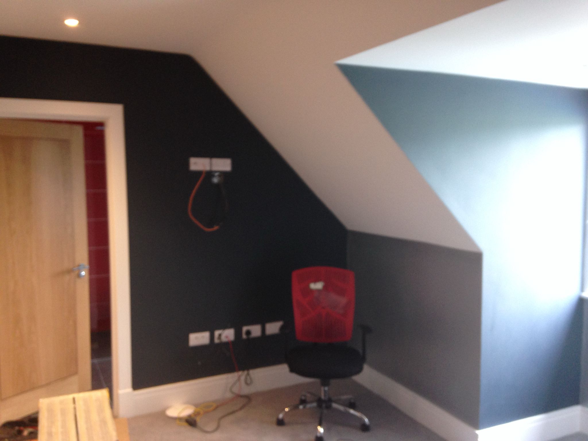 Paint and decorating project with blue walls and white woodwork