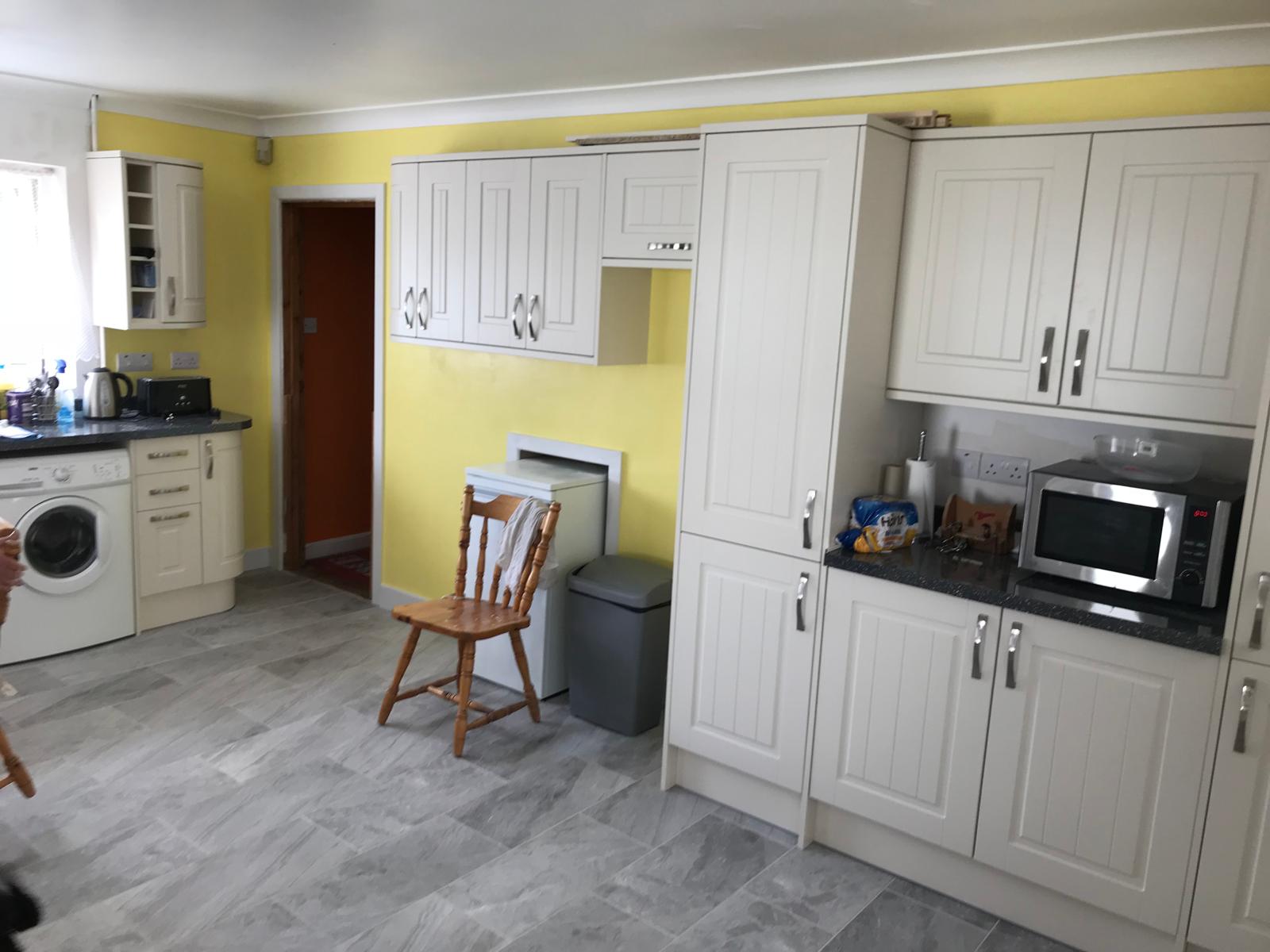 Painted yellow walls on kitchen installation project