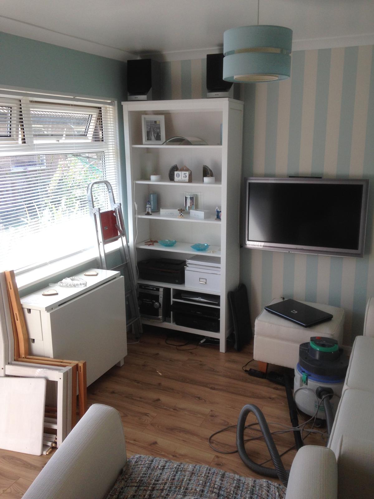 Painting and decorating project with duck egg blue painted walls and stripped wall paper