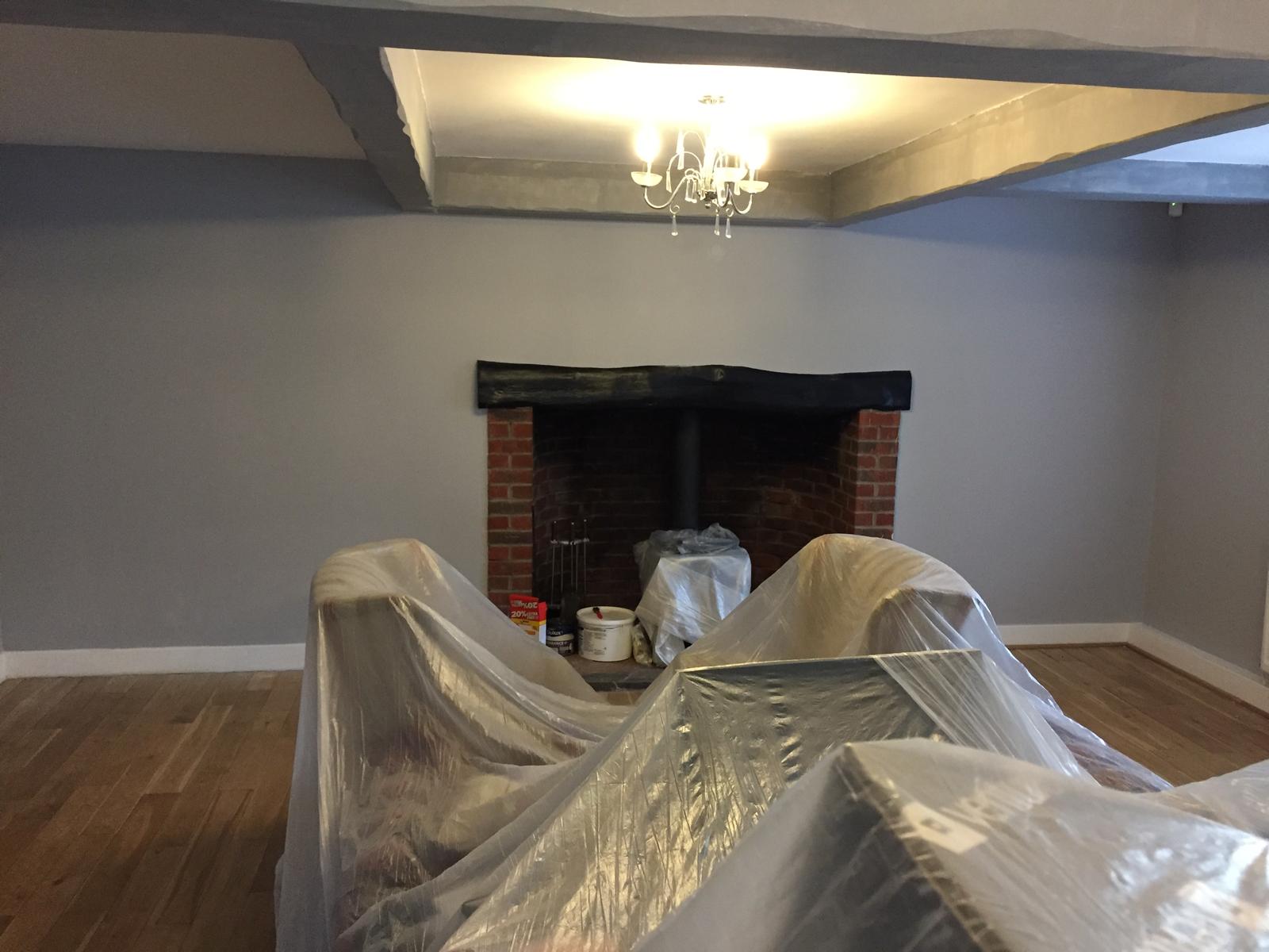 Painting and decorating project with grey painted walls and white wood work