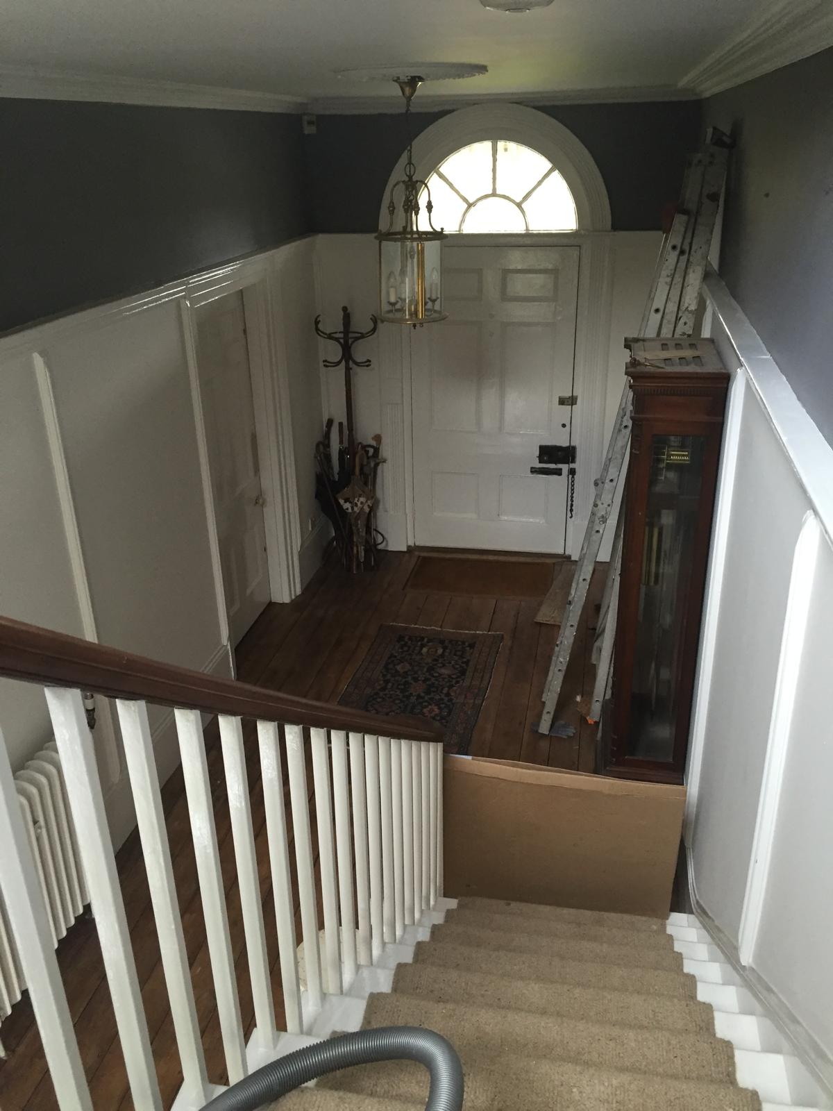 Painting and decorating project with grey walls and white wood work