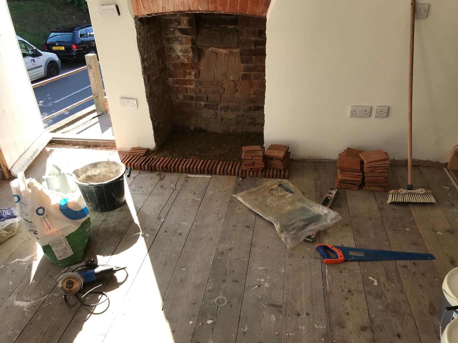 Painting and decorating project with wall repair and fire place restoration